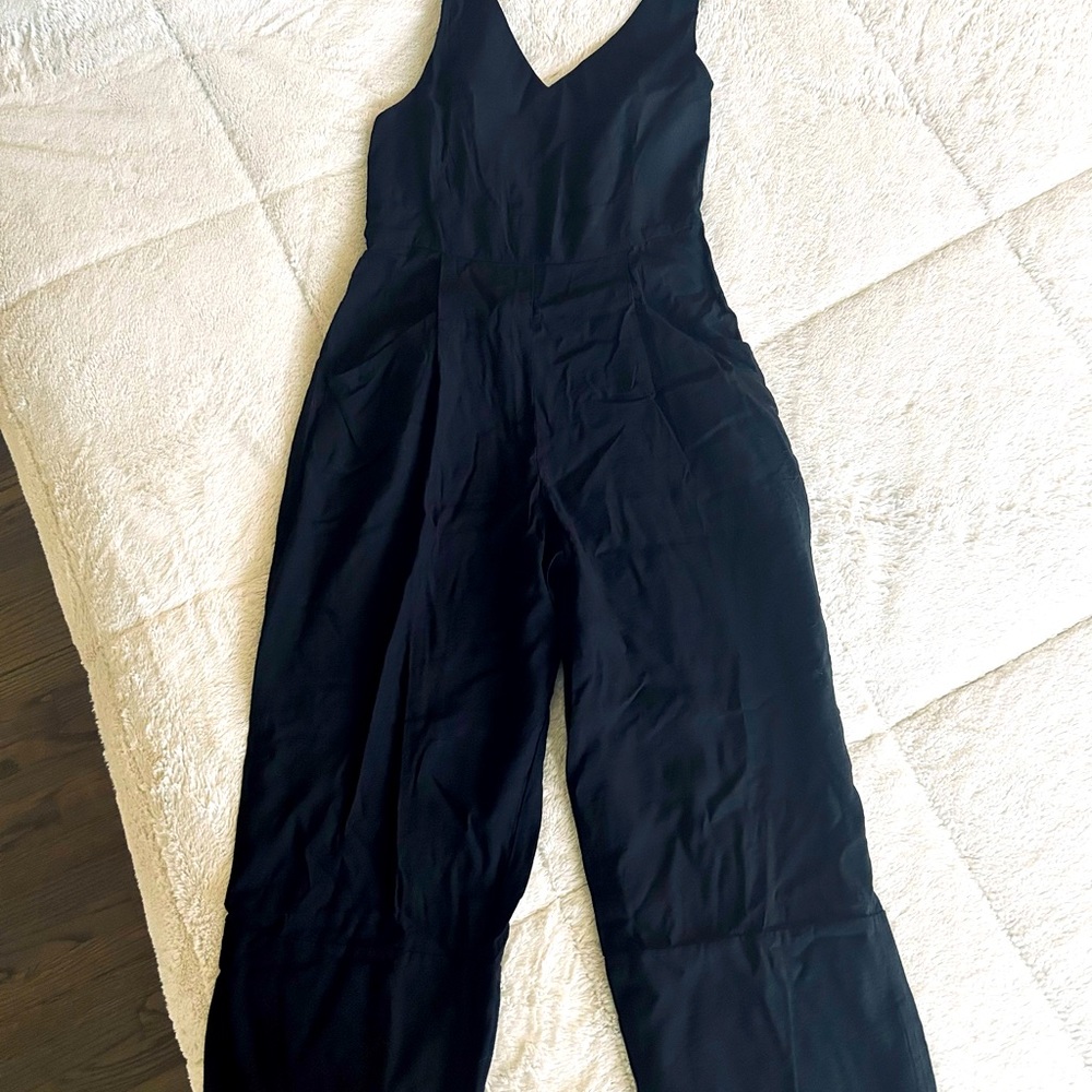 Beautiful black jumpsuit. You can dress up or down. Super comfortable